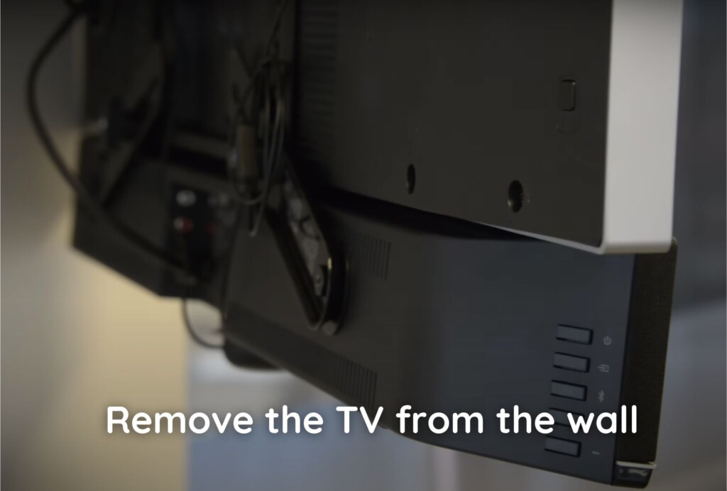 If the TV is already mounted, remove it from the wall